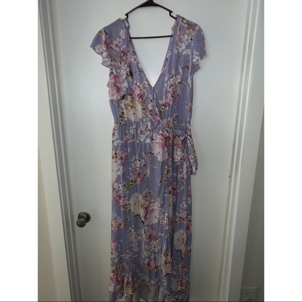 This dress is purple with cream and pink flowers.